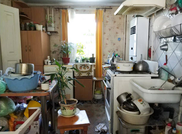 mess and dump. An old room with lots of things. Devastation. Very small housing.